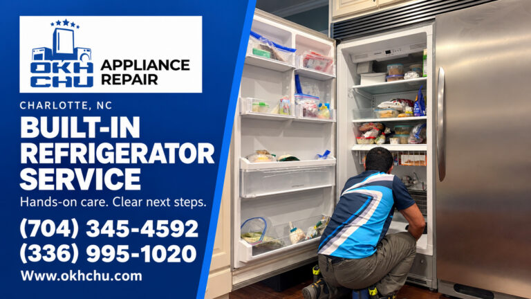 OKHCHU technician working inside an open built-in refrigerator, beside a blue service panel with contact details.